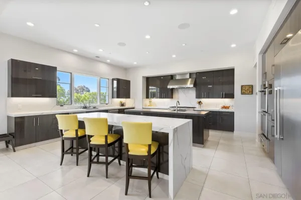 a kitchen with a table and chairs in it