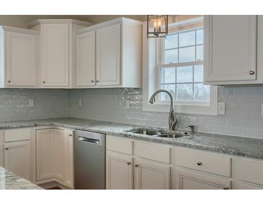 68 B Barrel Road Westminster, MA 01473 - Photo 11 of 26 a kitchen with granite countertop white cabinets and sink