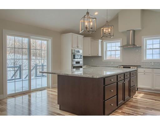 68 B Barrel Road Westminster, MA 01473 - Photo 12 of 26 a kitchen with stainless steel appliances granite countertop a sink stove and cabinets