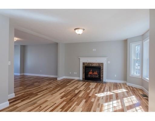 68 B Barrel Road Westminster, MA 01473 - Photo 8 of 26 a view of an empty room with a window and fireplace