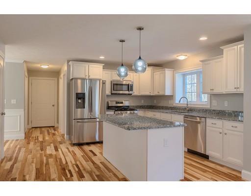 68 B Barrel Road Westminster, MA 01473 - Photo 10 of 26 a kitchen with stainless steel appliances granite countertop a refrigerator a sink dishwasher a stove and white cabinets with wooden floor