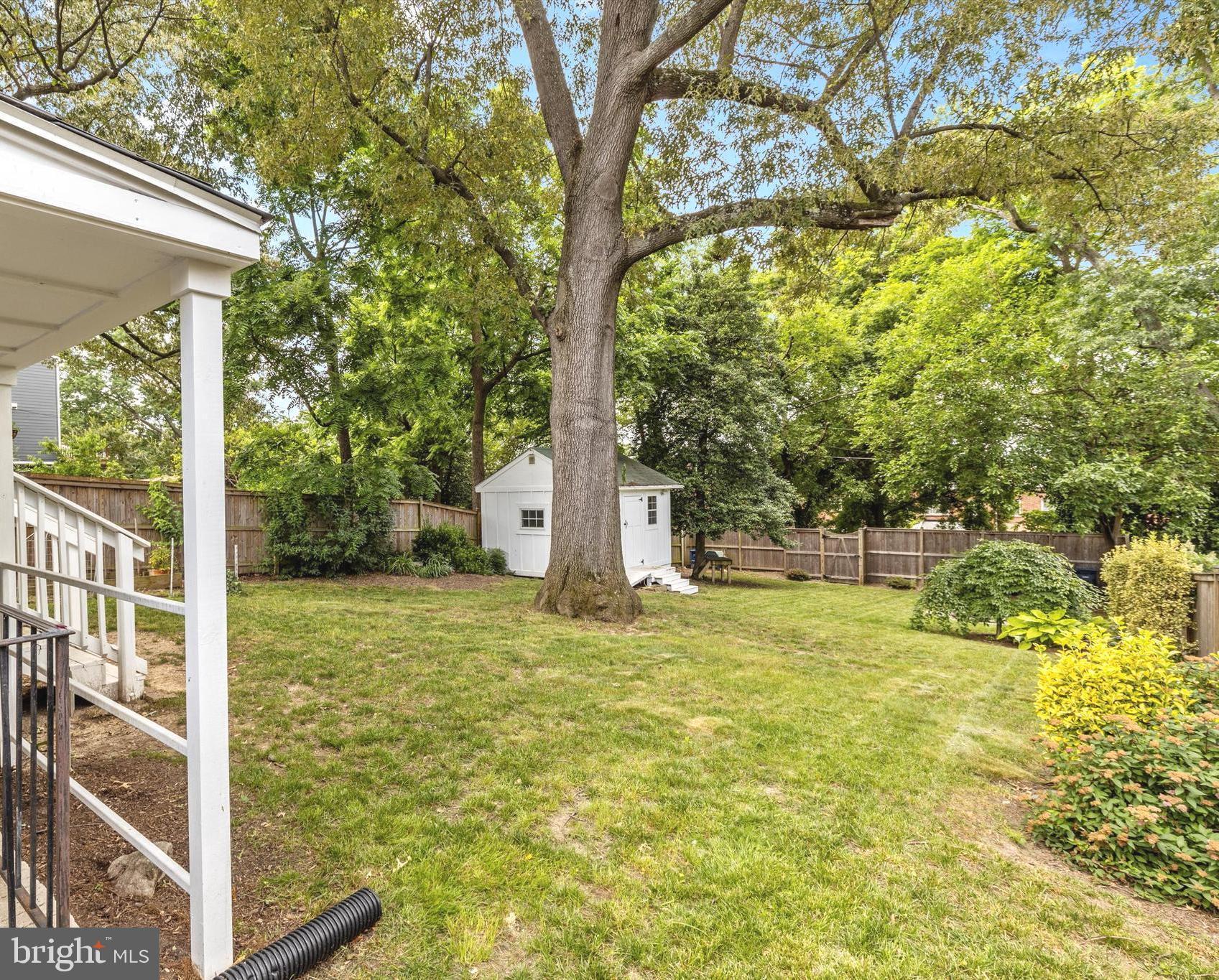 6118 Sligo Mill Road Northeast Washington, DC 20011 - Photo 28 of 28 a house with trees in front of it