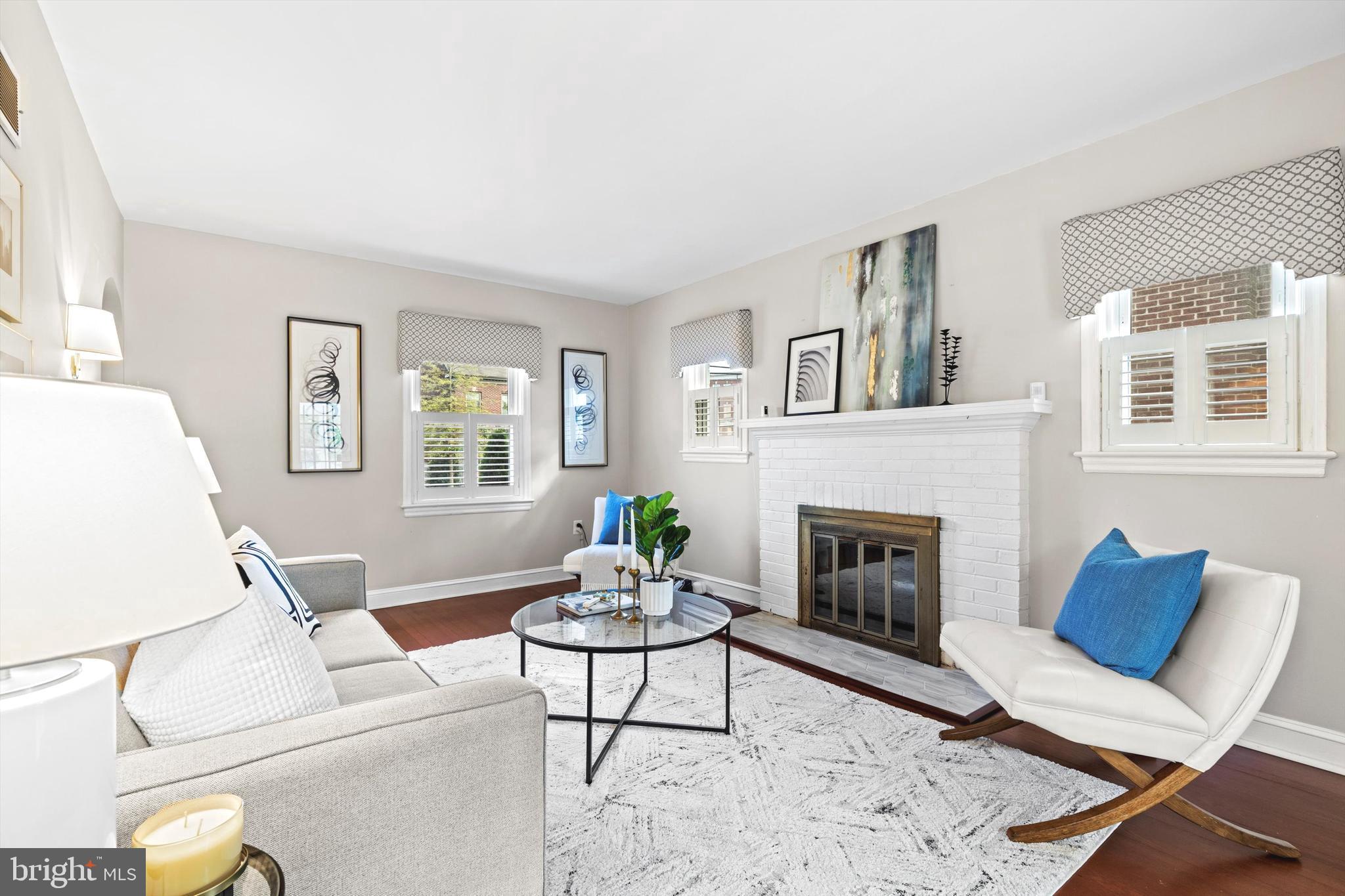 6118 Sligo Mill Road Northeast Washington, DC 20011 - Photo 8 of 28 a living room with furniture a fireplace and a window