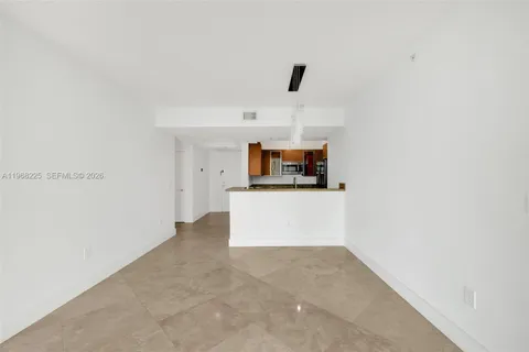 a view of a kitchen with microwave and cabinets