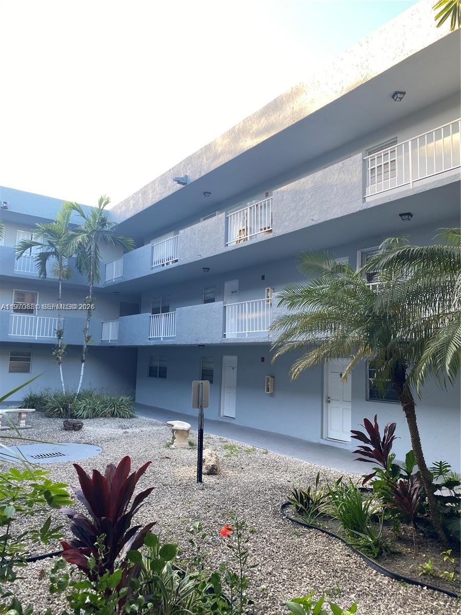 1735 West 60th Street, Unit M301 Hialeah, FL 33012 - Photo 1 of 29 a view of a yard with potted plants