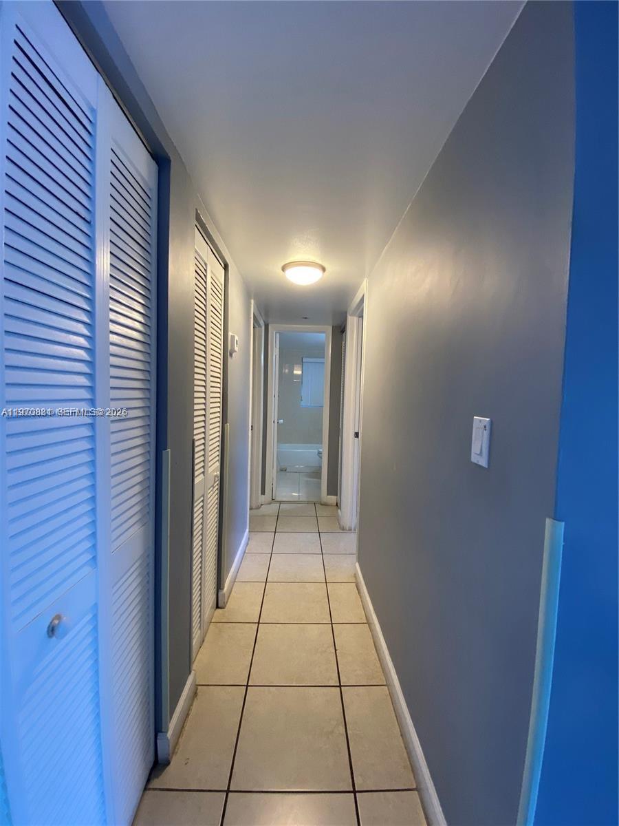 1735 West 60th Street, Unit M301 Hialeah, FL 33012 - Photo 11 of 29 a view of a hallway