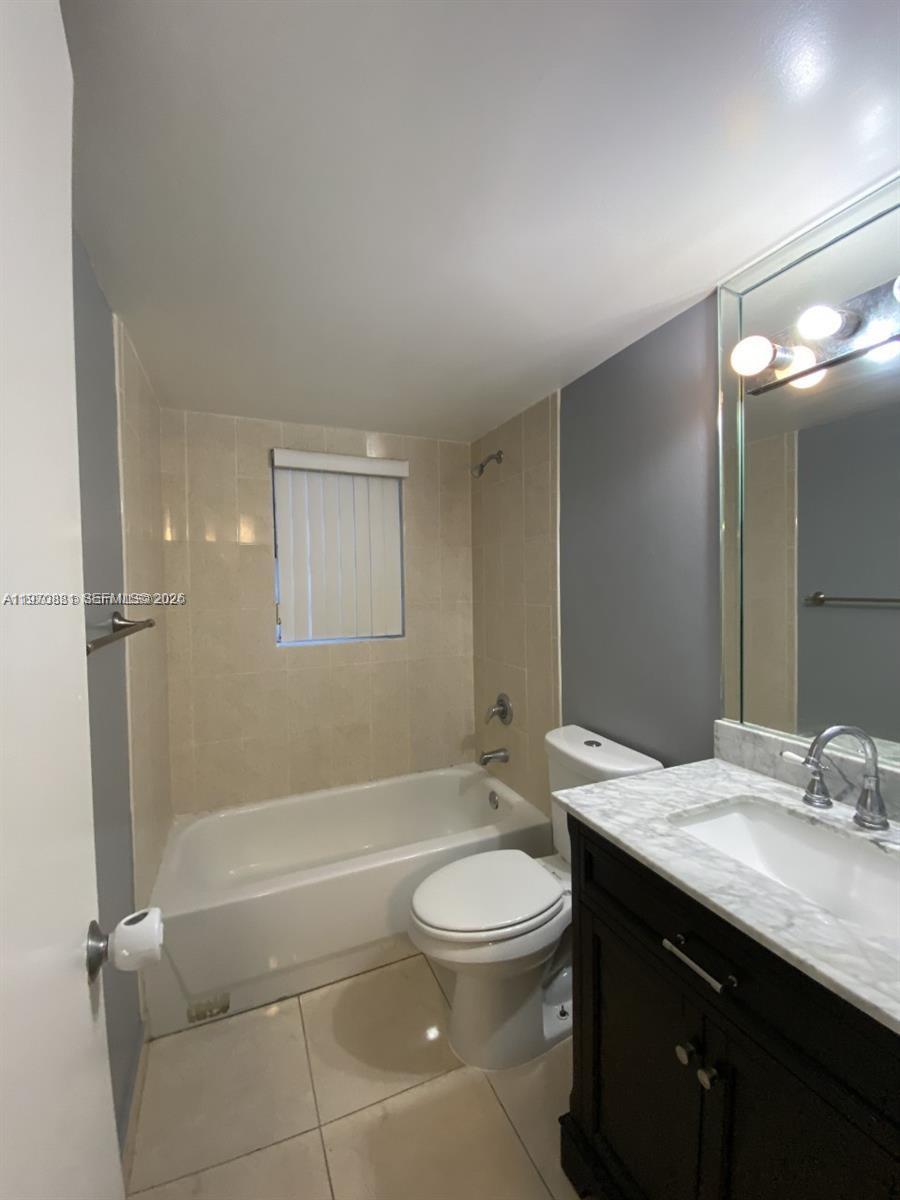 1735 West 60th Street, Unit M301 Hialeah, FL 33012 - Photo 16 of 29 a bathroom with a granite countertop sink toilet and shower
