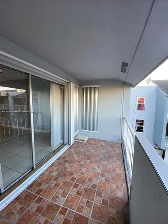 a view of an empty room with a fireplace