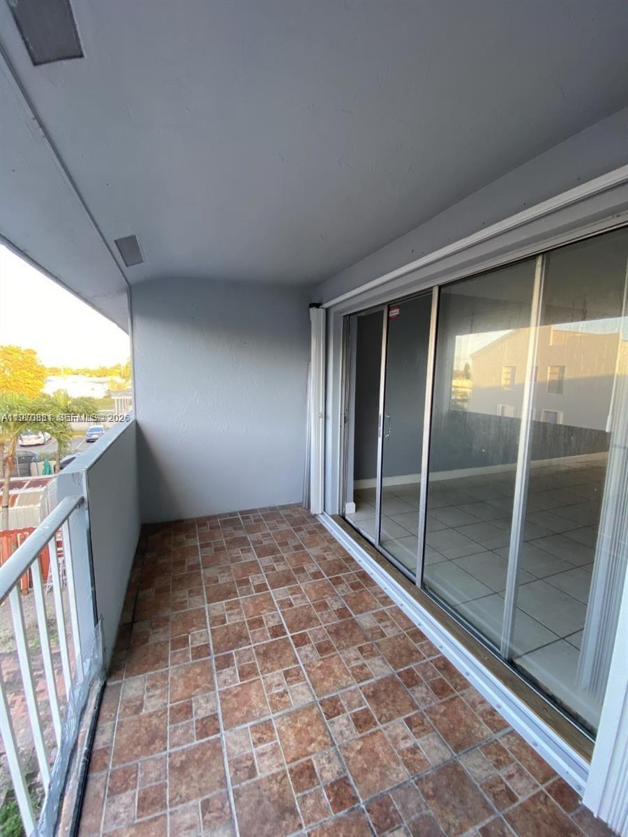 1735 West 60th Street, Unit M301 Hialeah, FL 33012 - Photo 24 of 29 a view of an empty room and window