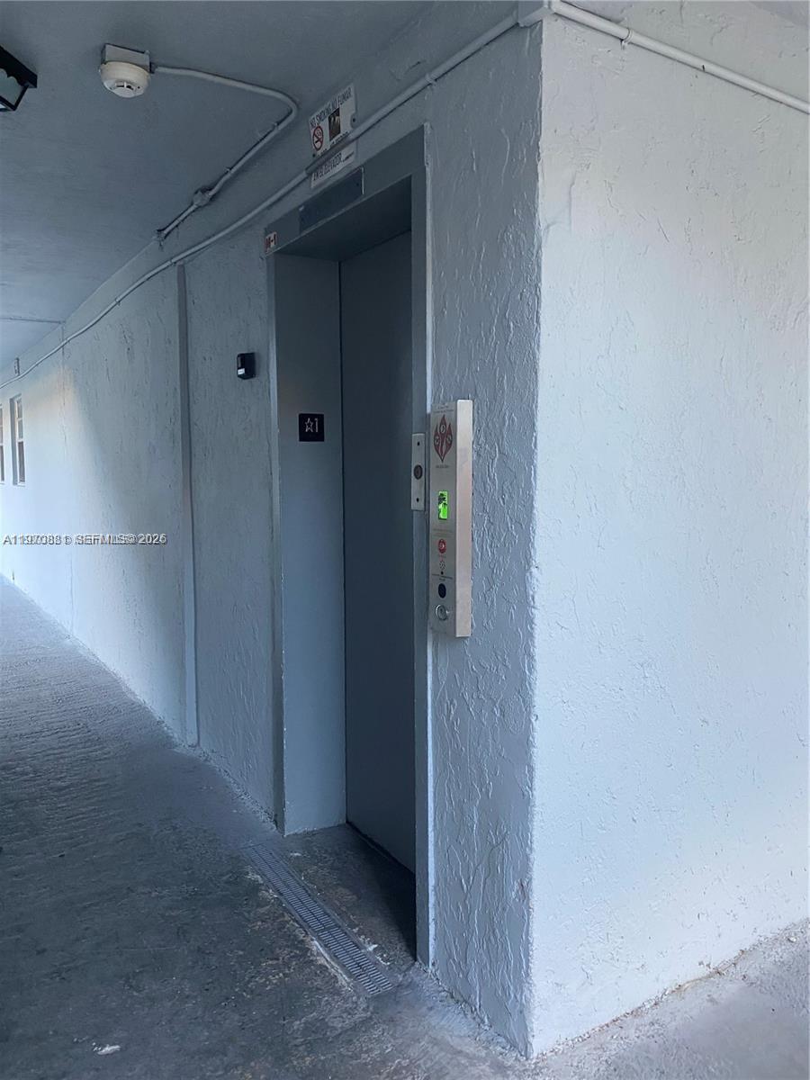 1735 West 60th Street, Unit M301 Hialeah, FL 33012 - Photo 3 of 29 a view of a hallway
