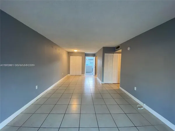 a view of an empty room and window