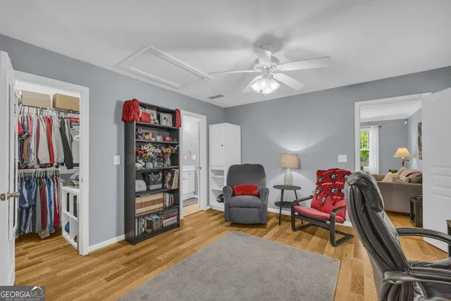 a livingroom with workspace and a window