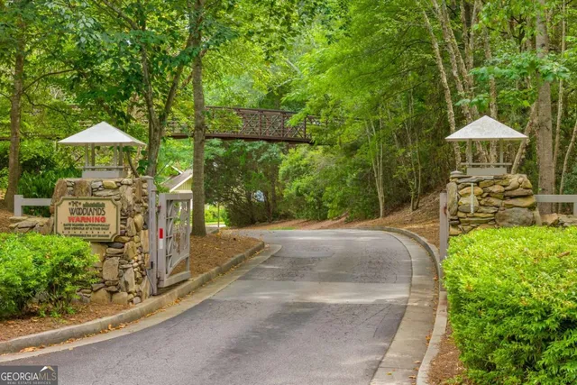 a view of a patio with table and chairs under an umbrella