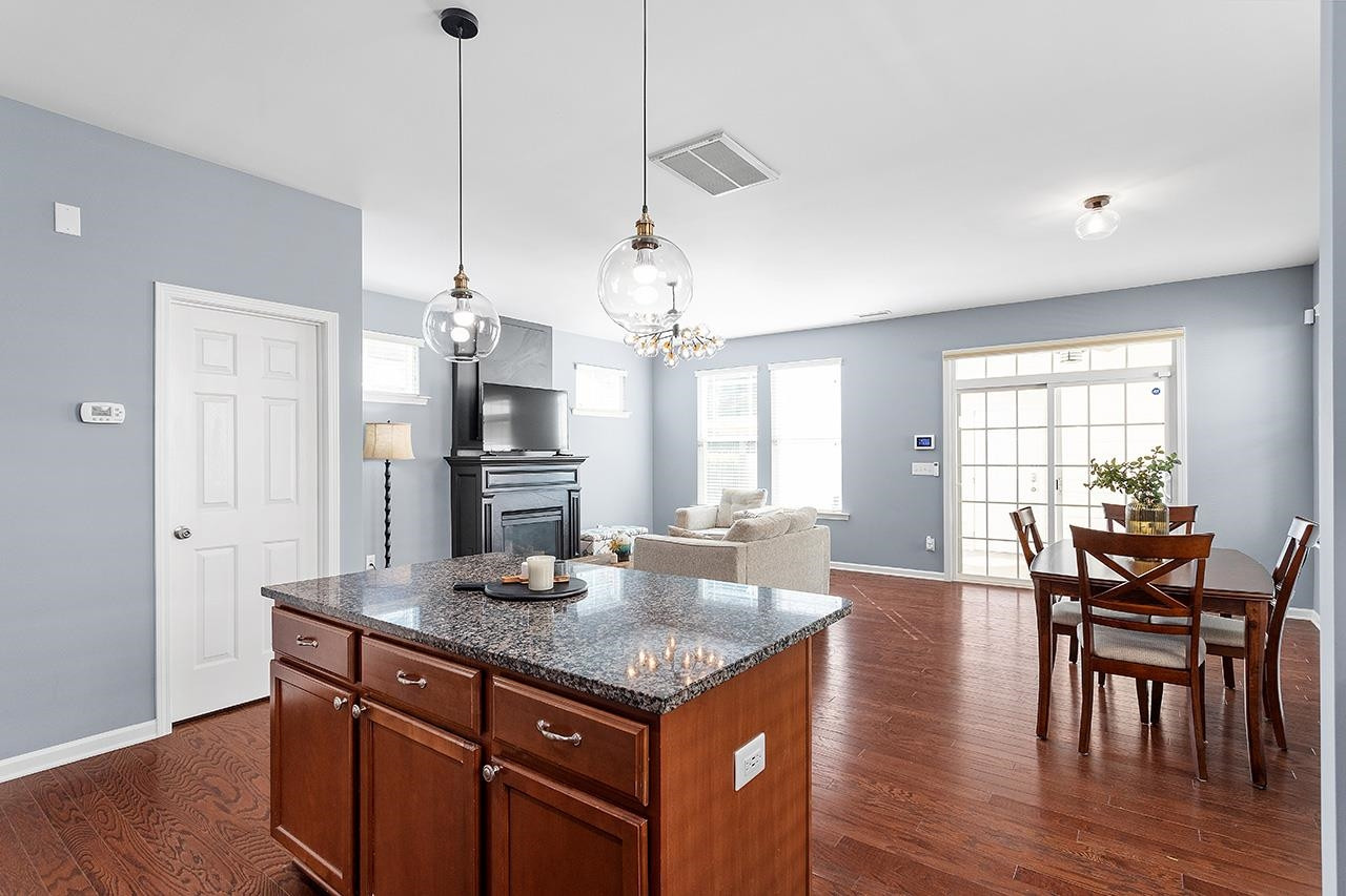 1032 Ileagnes Road Raleigh, NC 27603 - Photo 15 of 29 a open kitchen with stainless steel appliances granite countertop a stove and refrigerator