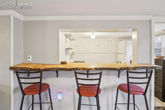 9025 Picabo Road Cascade, CO 80809 - Photo 29 of 43 Live edge Breakfast Bar