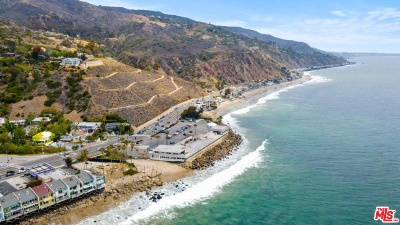 3945 Las Flores Canyon Road Malibu, CA 90265 - Photo 11 of 45 a view of a house with a yard