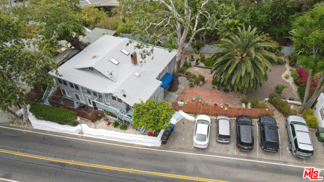 3945 Las Flores Canyon Road Malibu, CA 90265 - Photo 2 of 45 an aerial view of a house with garden space and street view