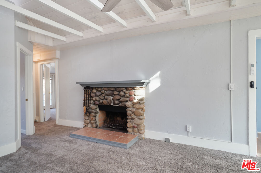 3945 Las Flores Canyon Road Malibu, CA 90265 - Photo 34 of 45 an empty room with a fireplace