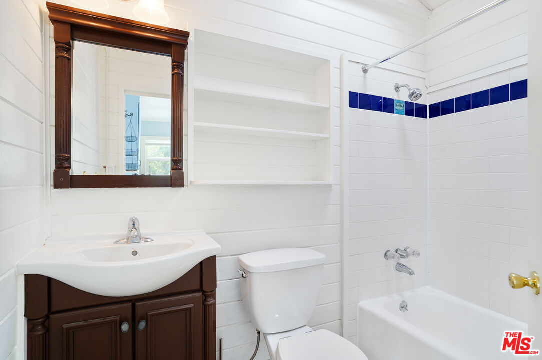3945 Las Flores Canyon Road Malibu, CA 90265 - Photo 40 of 45 a bathroom with a sink toilet a mirror and shower