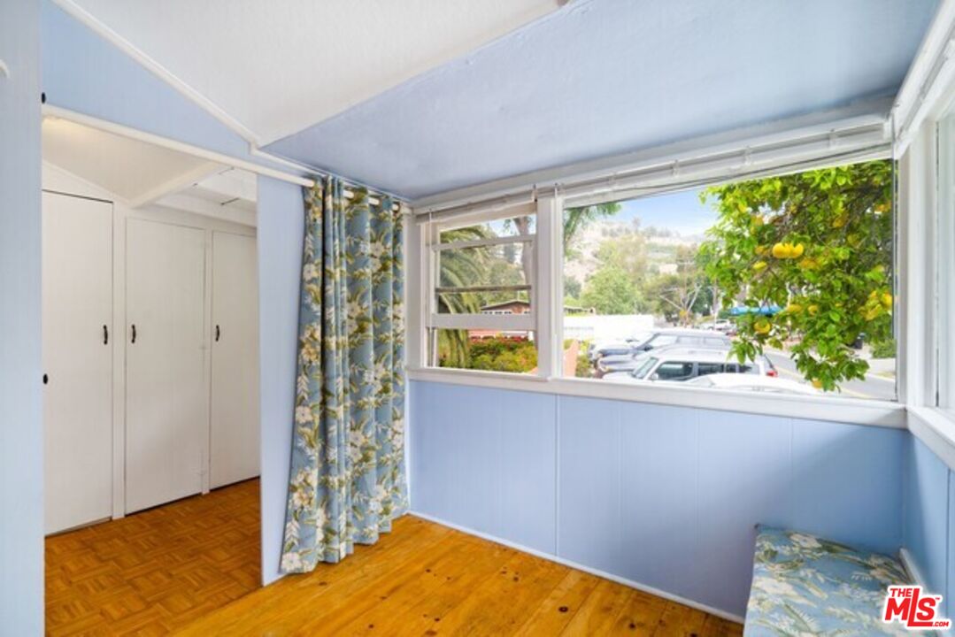 3945 Las Flores Canyon Road Malibu, CA 90265 - Photo 8 of 45 a view of a bedroom with window
