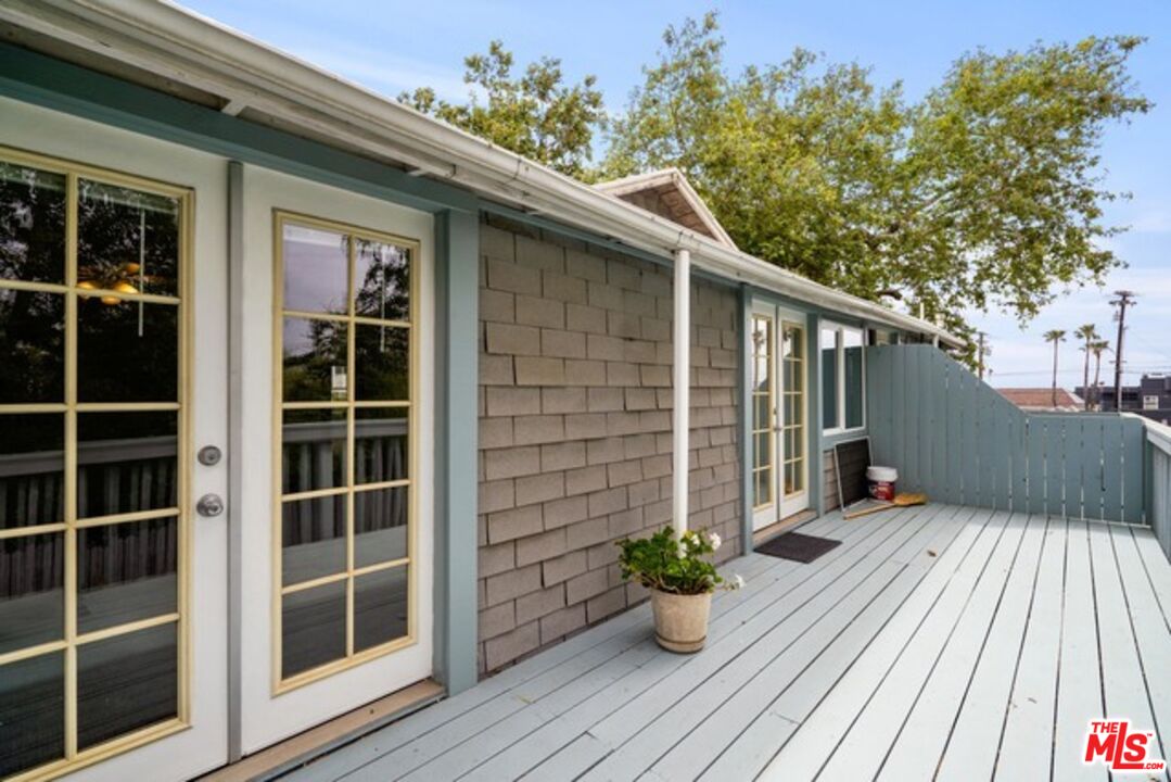 3945 Las Flores Canyon Road Malibu, CA 90265 - Photo 9 of 45 a view of a house with a large window and wooden floor