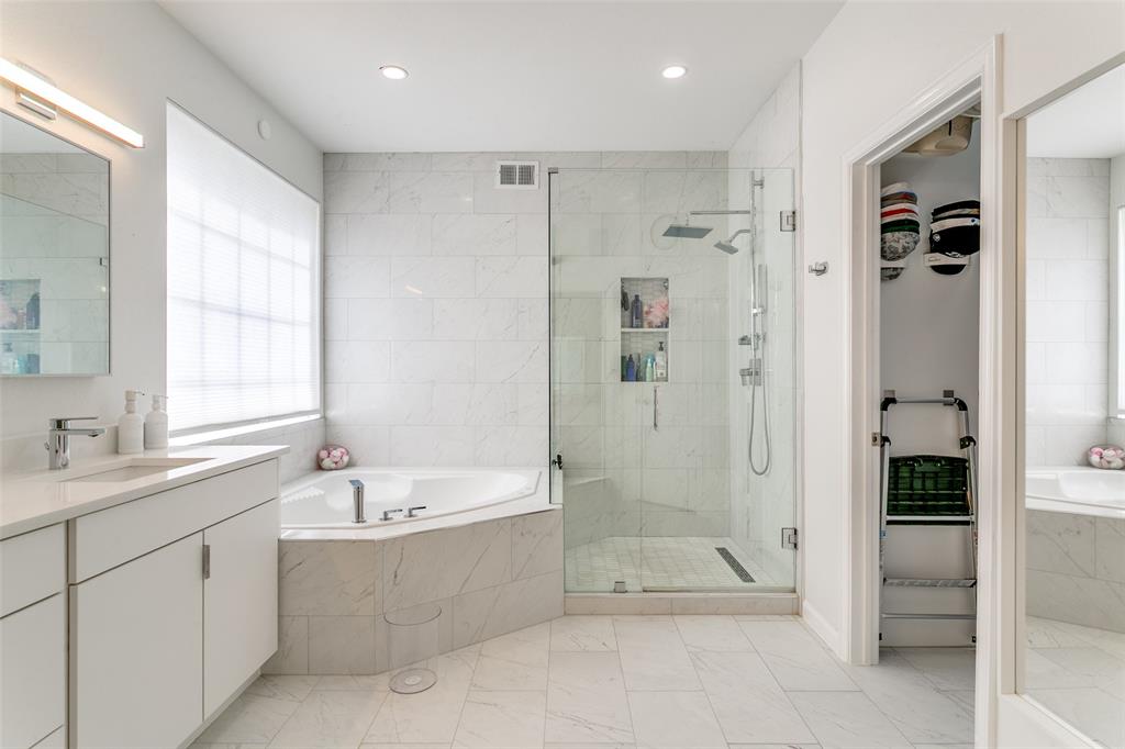 1509 Blue Mesa Road Carrollton, TX 75007 - Photo 23 of 35 a bathroom with a shower a sink and a mirror