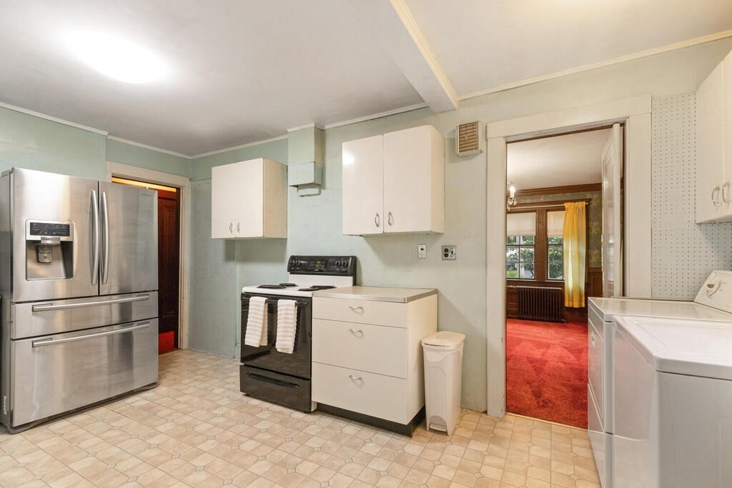 5 Hosmer Circle Newton, MA 02465 - Photo 16 of 32 a kitchen with a stove top oven and refrigerator