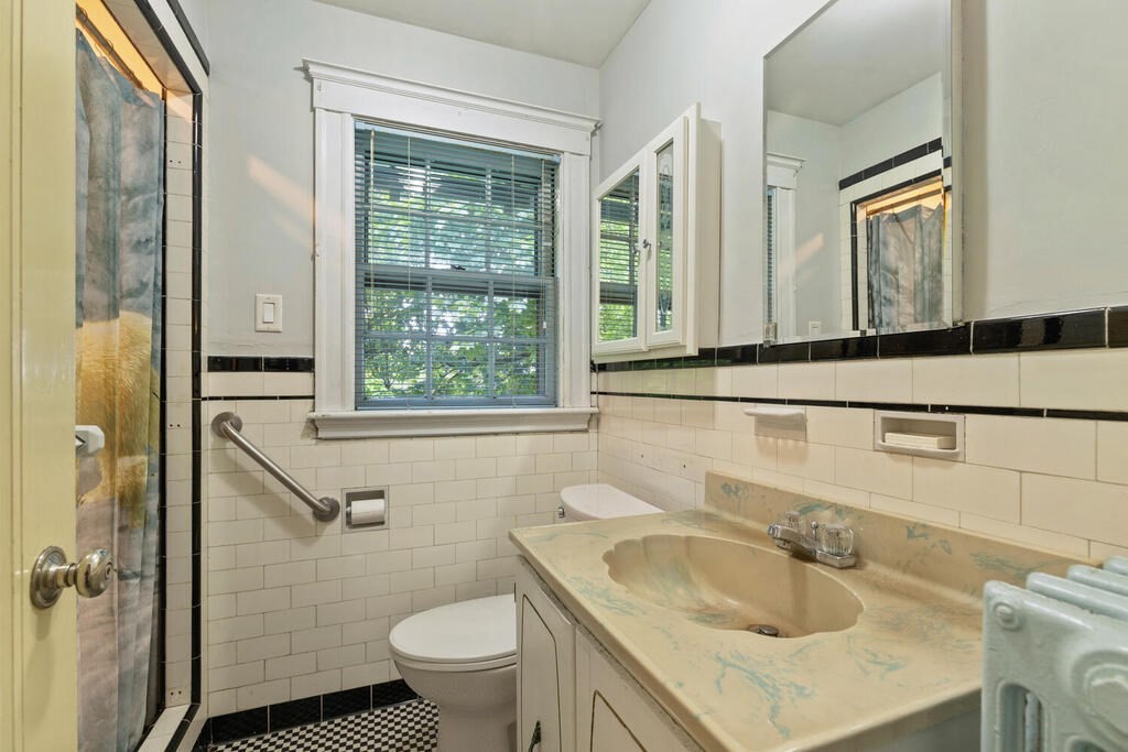 5 Hosmer Circle Newton, MA 02465 - Photo 26 of 32 a bathroom with a sink a toilet and a mirror
