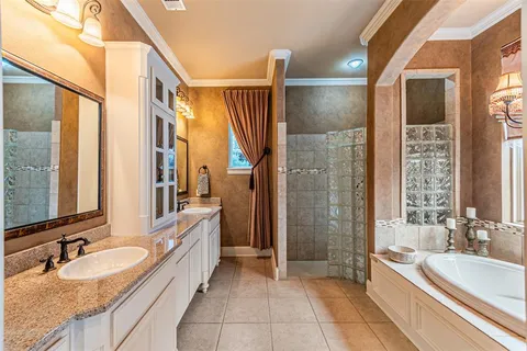 a bathroom with a sink a mirror a window and a shower