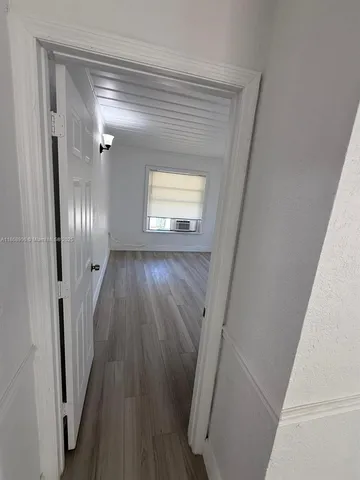 a view of entryway with wooden floor