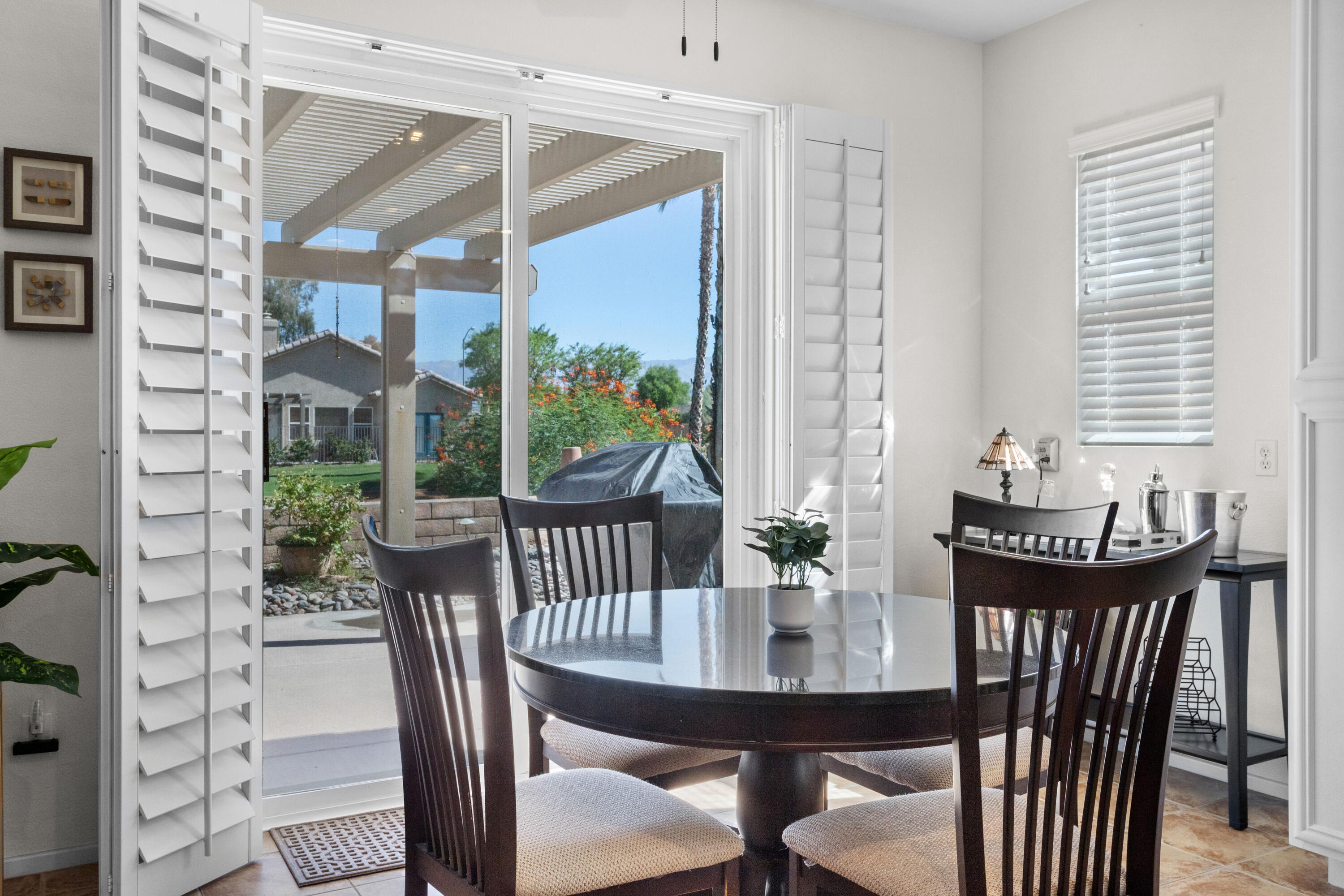 82664 Heston Drive Indio, CA 92201 - Photo 26 of 75 a view of a dining room with furniture window and outside view