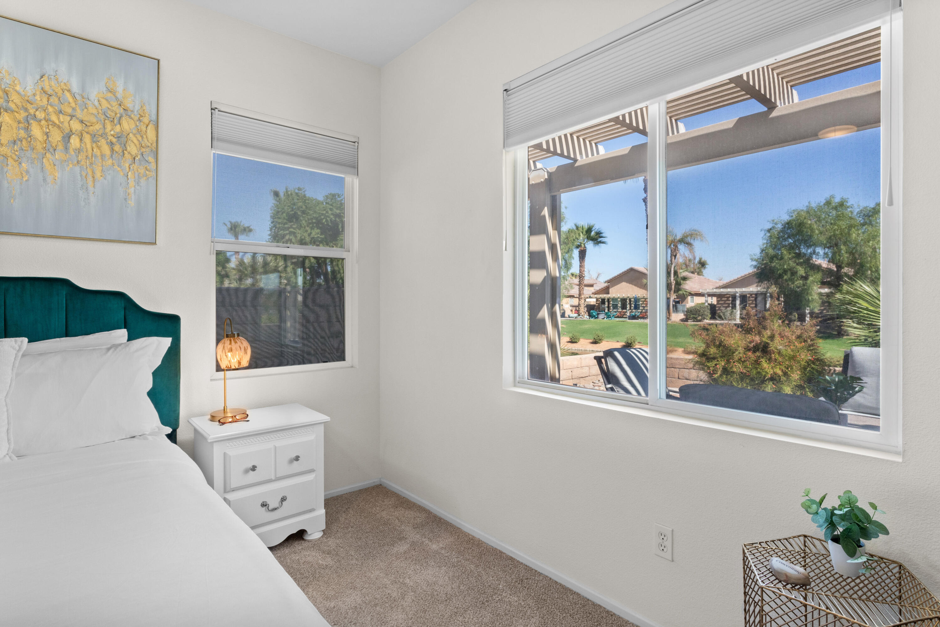 82664 Heston Drive Indio, CA 92201 - Photo 36 of 75 a bedroom with a bed and a window