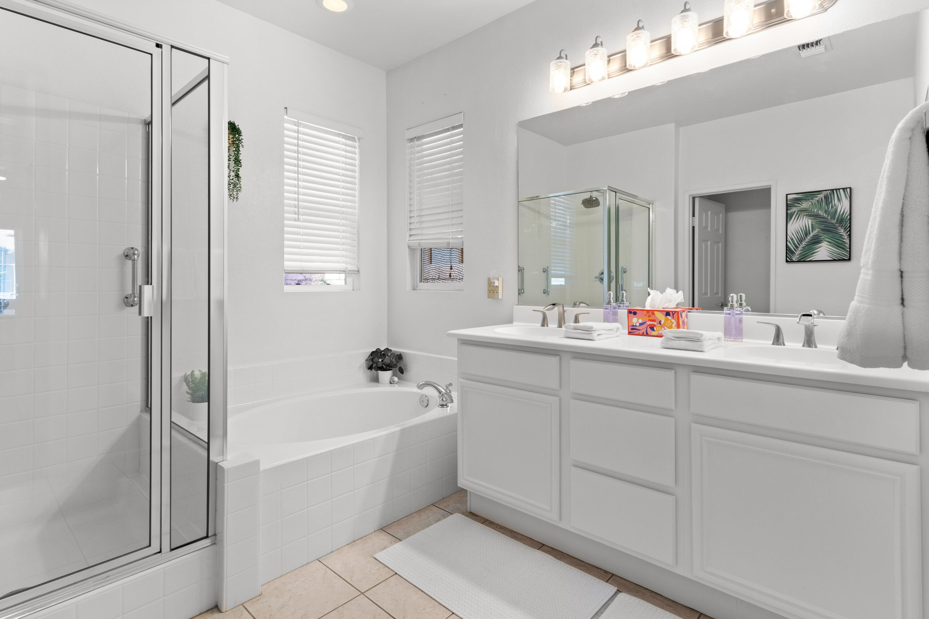 82664 Heston Drive Indio, CA 92201 - Photo 37 of 75 a bathroom with a tub sink shower and mirror