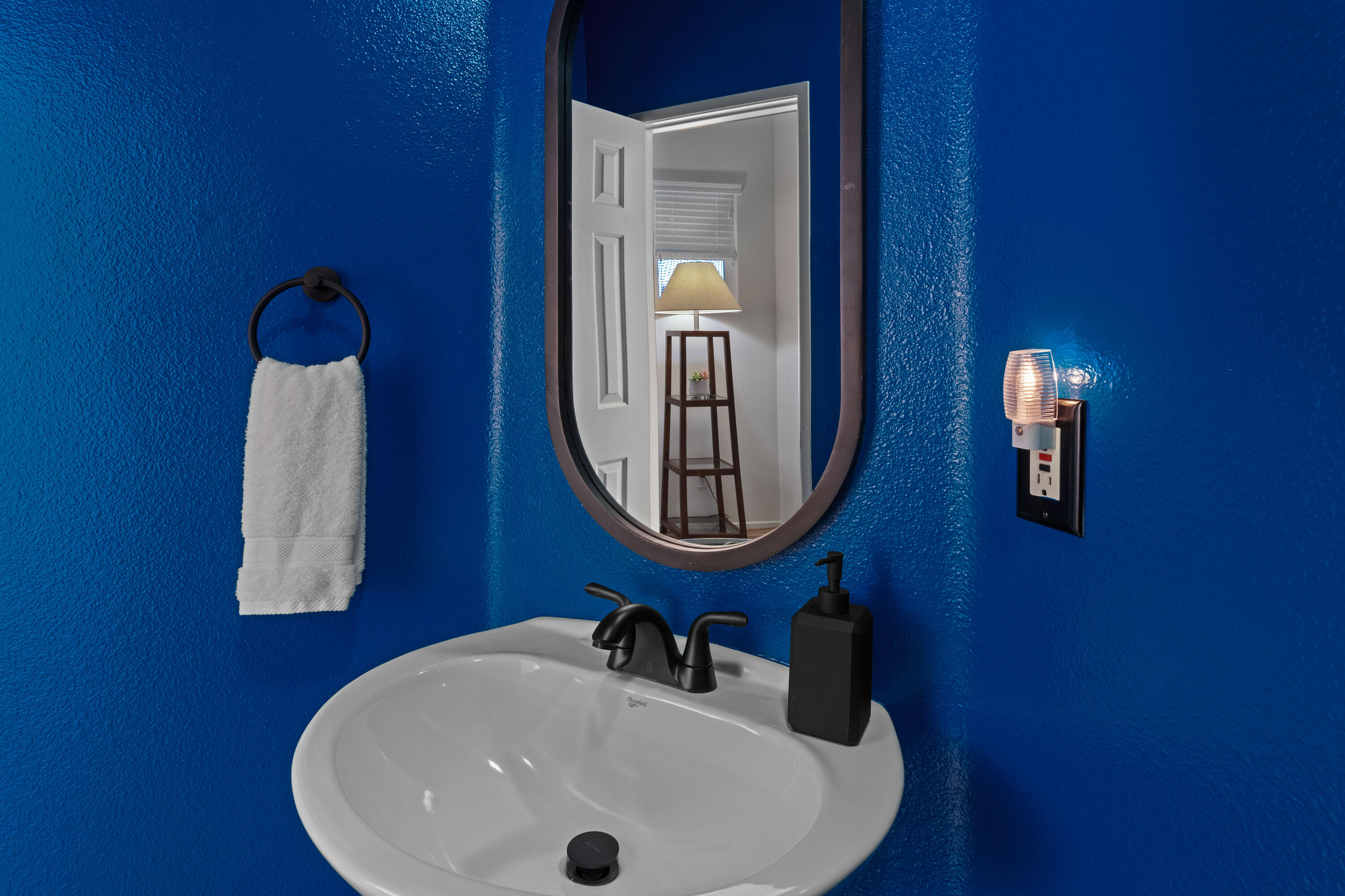 82664 Heston Drive Indio, CA 92201 - Photo 59 of 75 a bathroom with a sink and a mirror