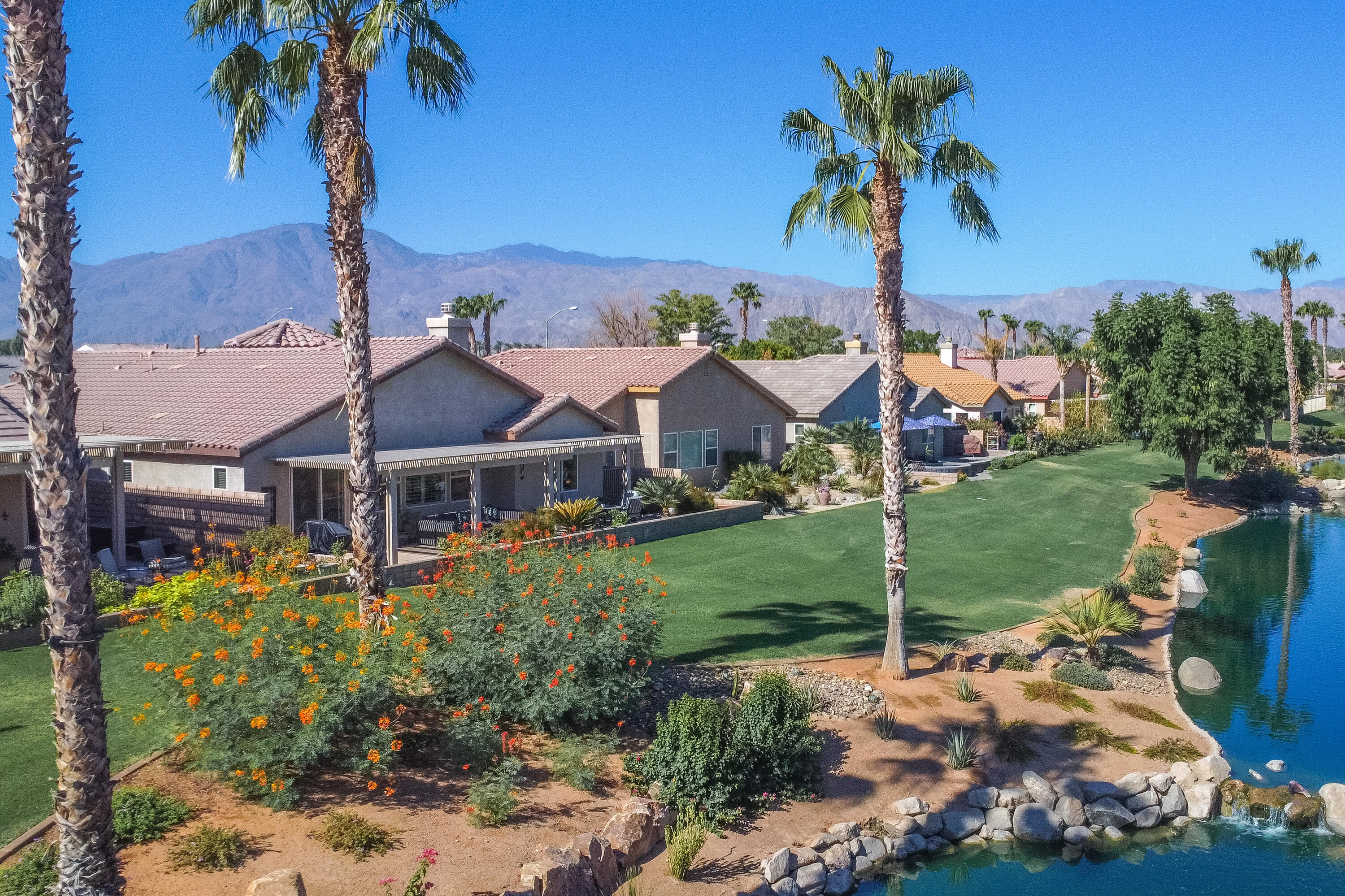 82664 Heston Drive Indio, CA 92201 - Photo 70 of 75 a front view of a house with garden