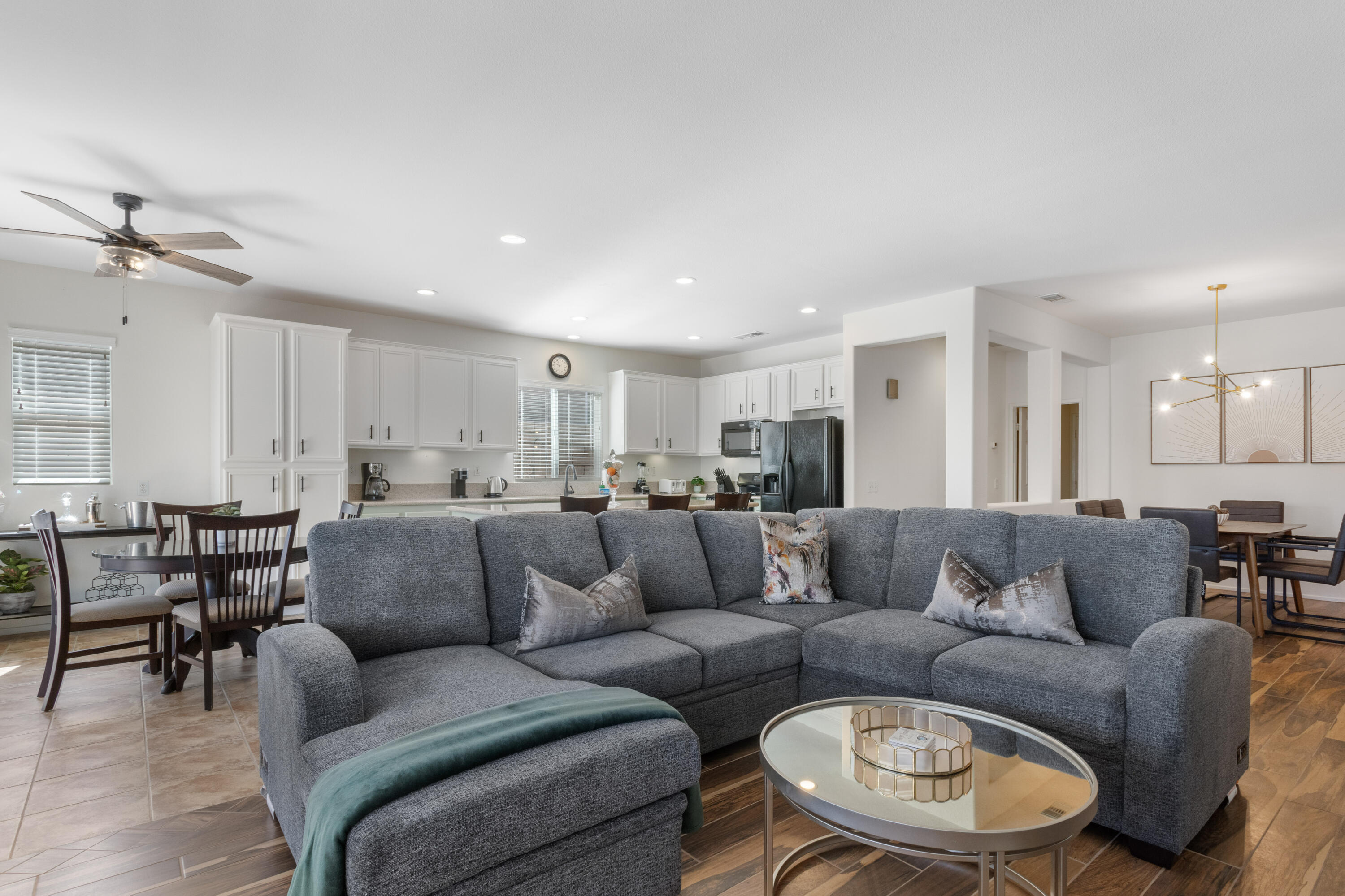 82664 Heston Drive Indio, CA 92201 - Photo 9 of 75 a living room with furniture and a dining table with kitchen view