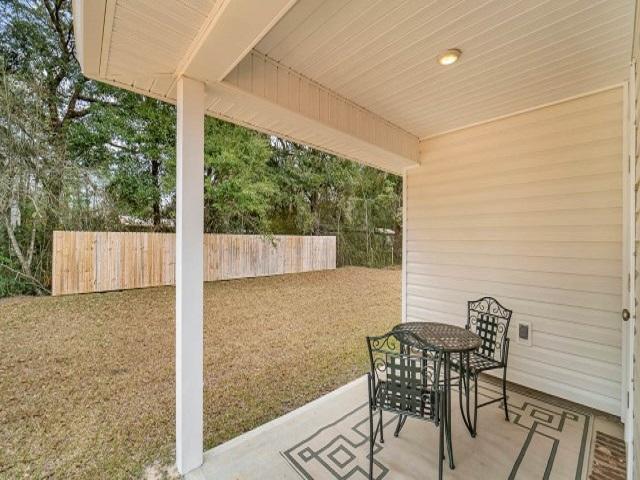 4659 Honor Guard Way Crestview, FL 32539 - Photo 15 of 25 a view of chair and table in the patio