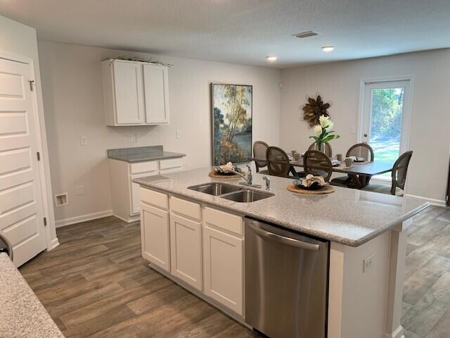 4659 Honor Guard Way Crestview, FL 32539 - Photo 3 of 25 a kitchen with sink and cabinets