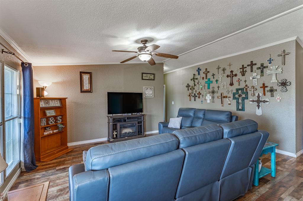 75 Southern Road Mineral Wells, TX 76067 - Photo 12 of 31 a living room with furniture and a flat screen tv