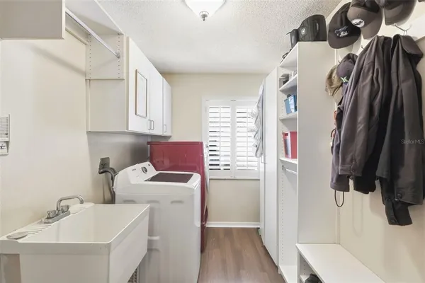 a living room with furniture a fireplace and a large window