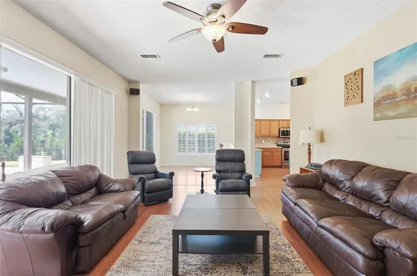 a living room with furniture rug and wooden floor