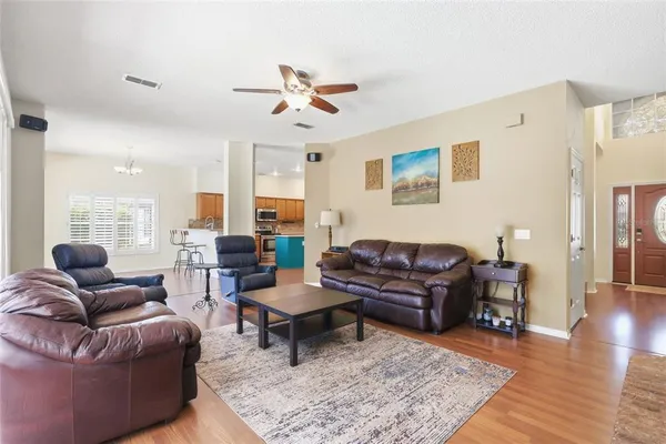 an empty room with cabinet and wooden floor