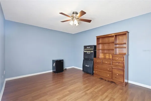 a living room with furniture and large windows