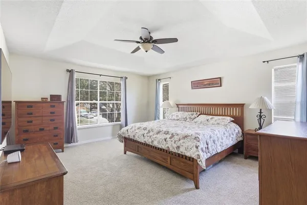 a bedroom with a bed and a cabinets