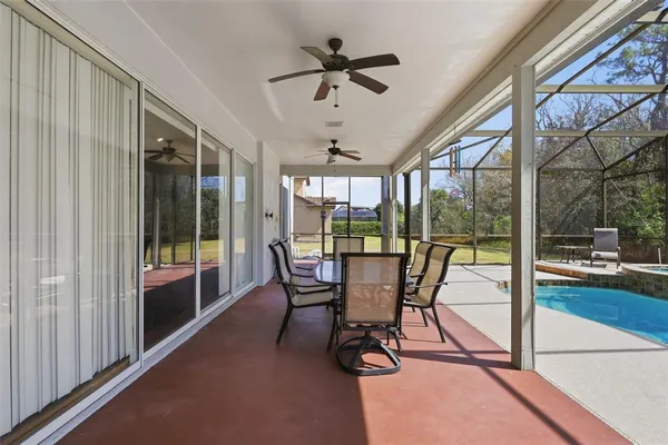 a view of a swimming pool with a patio