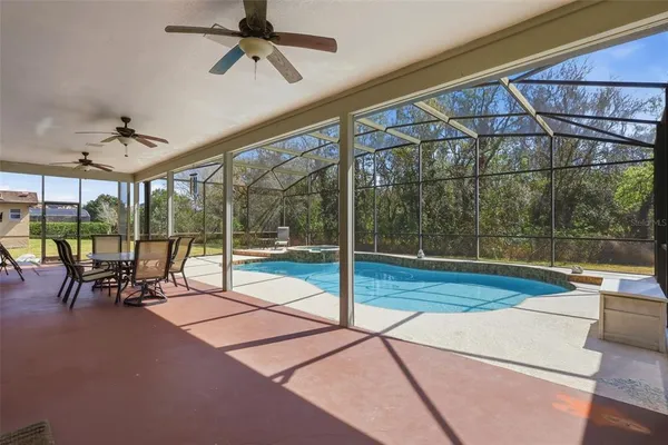 a view of a patio with a table and chairs