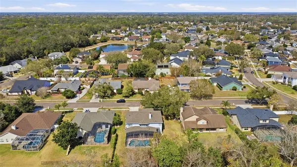 an aerial view of residential houses with outdoor space