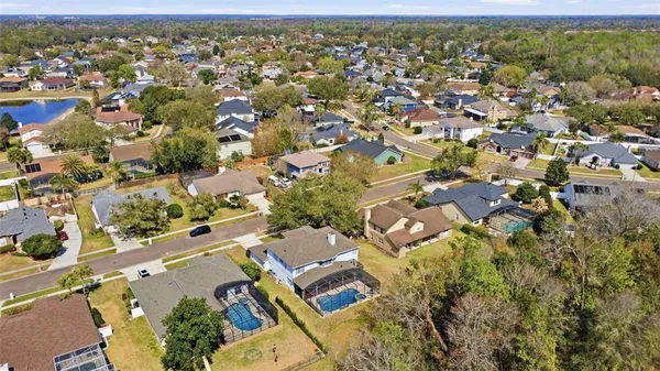 an aerial view of residential houses with outdoor space