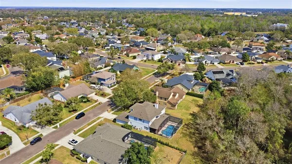 an aerial view of residential houses with outdoor space