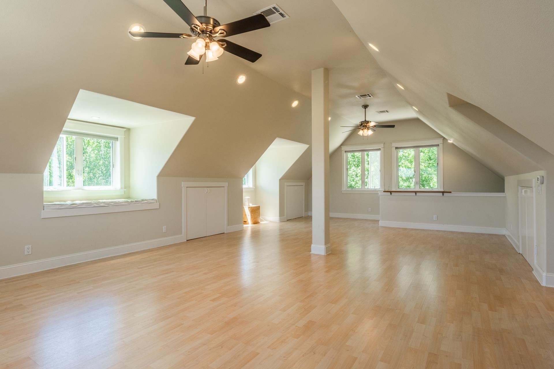 22 Juniper Drive, Unit 2 Mammoth Lakes, CA 93546 - Photo 27 of 50 an empty room with wooden floor fan and windows
